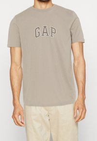 GAP Triko s potiskem - beige