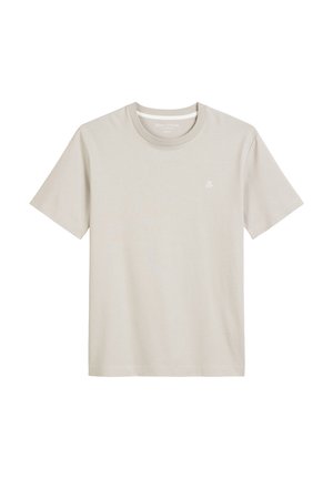 Light beige T-shirt made of soft fabric. Features a crew neck, short sleeves, and a small “M OP” logo on the left chest.