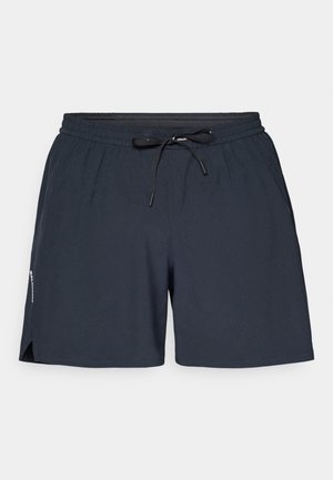 Navy blue athletic shorts made of lightweight fabric, featuring an elastic waistband, drawstring, and side slits for ease of movement.