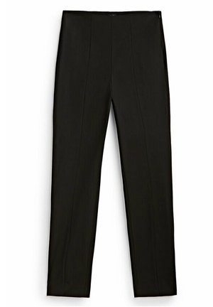 Pantalon noir slim avec coutures avant et ceinture, posé à plat sur un fond blanc.