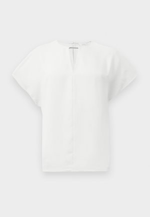 Valge lühikeste varrukatega särk V-kaelusega ja selja tõmblukuga. Sile kangas struktureeritud kujuga, ilma nähtavate mustrite või kaunistusteta.