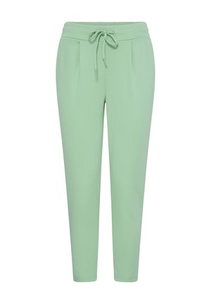 Light green tapered pants with elastic waistband and front drawstring, featuring subtle pleats near the hips.