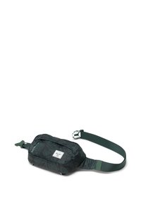 Pochette en tissu à carreaux noirs et verts avec une sangle ajustable, fermeture éclair et petite étiquette de logo. Forme rectangulaire compacte. Matériau durable.