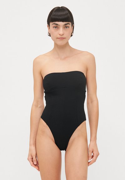 Sorte strapless éndelt swimsuit med en tætsiddende overdel, højt skårede ben og glat tekstur, med minimale sømme og uden yderligere detaljer.
