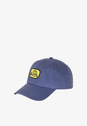 Casquette de baseball bleue avec un patch rectangulaire jaune présentant le logo noir "Von Dutch" et un graphisme de soleil à l'avant, visière arrondie et panneaux cousus.