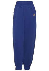 Blauwe sweatpants gemaakt van zachte stof, met een elastische tailleband, geribbelde boorden en een klein gouden logo op de linker heup.