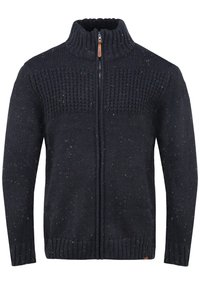 Marineblå strikket sweater med høj krave, struktureret øverste design, lynlås og multikolorede prikker i hele stoffet. Ribbet kant og ærmer.