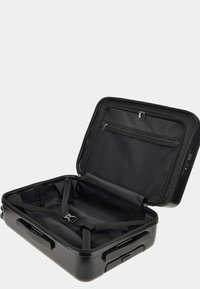 Black hard-shell suitcase with a zippered mesh pocket and interior straps; smooth interior lining, rectangular shape, and telescoping handle.