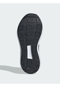 Suola in gomma nera con una superficie testurizzata, caratterizzata da un logo bianco e un motivo di battistrada non marcante, design ergonomico per il comfort.