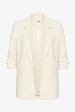 Kermakollane bleiser, millel on sile tekstuur, avatud esikülg, kohandatud disain, õlavarre ruššimine ja kaks esikotid. Brandi silt sees ütleb "soaked."