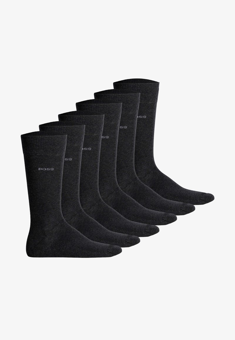 Sei paia di calzini grigio scuro, di spessore medio, con bordo a coste e un discreto logo sul lato. Tessuto liscio, punta senza cucitura.