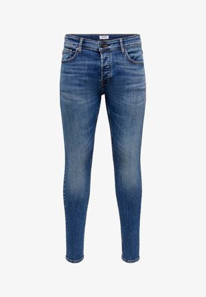Niebieskie dopasowane dżinsy z denimu z wyblaknięciami na udach, pięcioma kieszeniami, zapięciem na guziki i szlufkami na pasek.