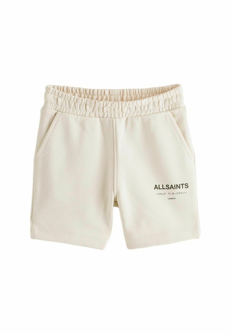 Shorts in cotone color crema con vita elasticizzata, due tasche laterali e un logo stampato del marchio sul davanti.