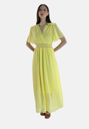 Robe maxi légère et jaune avec une taille smockée, des manches courtes volantes et une jupe fluide. Présente un design enroulé.