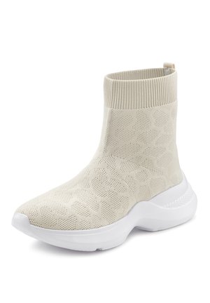 Beige knitted ankle boot with a textured leopard pattern, a soft cuff, and a white rubber sole, featuring a rounded toe and sleek design.