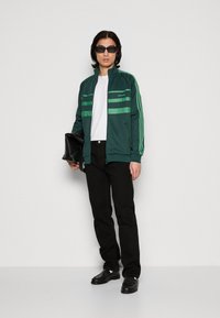 adidas Originals FIRST - Träningsjacka - mineral green