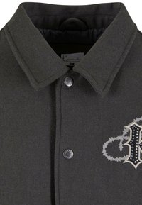 Gray wool button-up jacket with a wide collar, featuring a decorative black and silver embroidered design on the left side and metal buttons.
