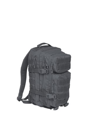 Black tactical backpack with multiple zippered compartments, adjustable straps, and MOLLE webbing on front and sides for attachments.