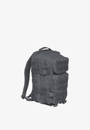 Sac à dos tactique noir avec plusieurs compartiments zippés, bretelles ajustables et sangles MOLLE à l'avant et sur les côtés pour des attaches.