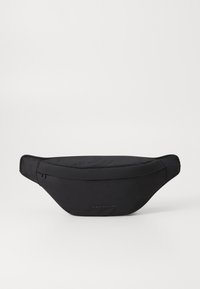 Sac banane noir en nylon au design épuré, avec un compartiment zippé et un logo discret. Texture lisse, forme ergonomique.