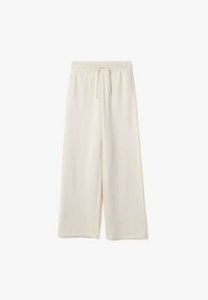 Pantaloni crema a gamba larga con cintura elastica e coulisse regolabile, dotati di tasche laterali e di un tessuto liscio e morbido al tatto.