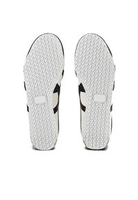 White rubber sneaker soles with textured diamond patterns, featuring black accents and a logo on the side.