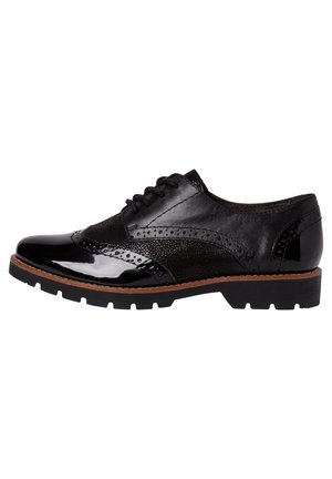 Schwarzer Leder-Schnürschuh im Brogue-Stil mit Flügelspitzen-Design, perforierten Details, klobiger Sohle und braunem Randabschluss.