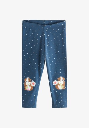 Colanți albaștri din material moale, cu mici puncte albe și două modele brodate de cobai cu flori pe partea inferioară a picioarelor.