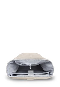 Beige laptop sleeve with a padded interior, a zippered pocket, and a strap closure inside for securing the device.