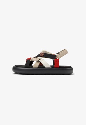 Schwarze Gummisohle Sandale mit mehrfarbigen Textilriemen in Beige, Schwarz und Rot. Verfügt über verstellbare Riemen für einen sicheren Sitz.