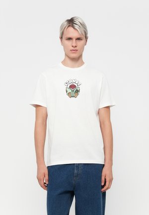 White cotton t-shirt featuring a colorful graphic design on the chest with the word "STRANGE" and various playful motifs. Short sleeves and round neck.