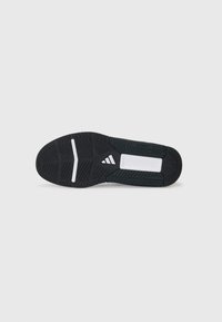 Black athletic shoe sole with rubber traction pattern, featuring white accents and logo. Flat design with smooth and textured surfaces.