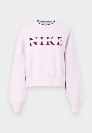 Svetloružový mikin s dlhým rukávom Nike s marhuľovým logom napísaným cez hrudník a rebrovanými manžetami a spodným lemom.
