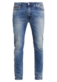 Hellblaue Skinny-Jeans aus Denim mit einem ausgewaschenen Finish. Verfügt über fünf Taschen, einen Knopfverschluss und dezente Stickdetails.
