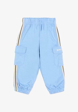 Pantalon bleu clair avec taille et chevilles élastiques, poches cargo latérales et bordure rayée beige et noire le long des côtés.