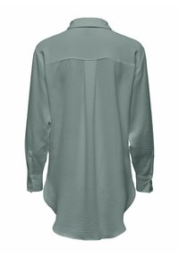 Long-sleeve shirt in muted green, featuring a textured fabric, pointed collar, buttoned cuffs, and a curved hemline.