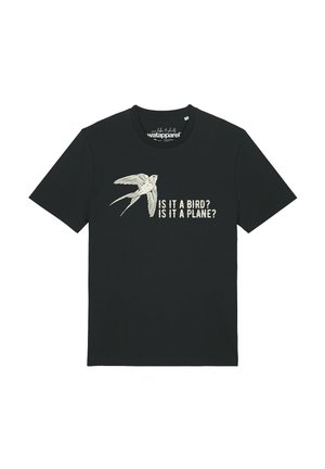 T-shirt noir avec une illustration blanche d’un oiseau et le texte "IS IT A BIRD? IS IT A PLANE?" imprimé sur le devant.