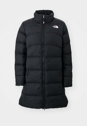 Black puffer coat with a high collar, zippered front, and stitched horizontal seams, featuring a logo on the left chest. Mid-length design.