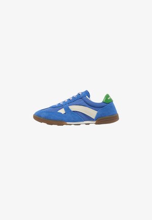Blue suede sneaker with white and green accents, round toe, perforated design, and rubber sole. Features white laces and logo detailing.