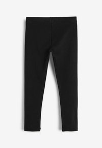 Leggings neri realizzati in tessuto elasticizzato, con una texture liscia, design a lunghezza completa e senza hardware o motivi visibili.