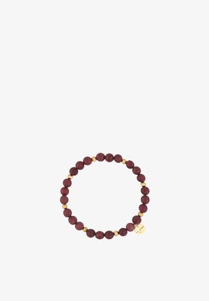 Bracelet with dark wooden beads alternating with small gold beads and a gold charm featuring a cross cutout.