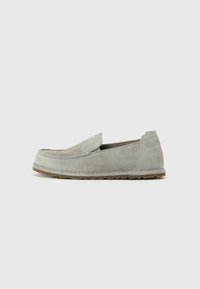 Gray suede slip-on shoes with a rounded toe, stitched detailing, and textured rubber outsole for grip. Simple and minimal design.