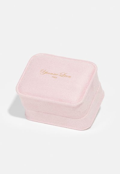 Pink rectangular jewelry box with a textured exterior, gold "Yvonne Leon Paris" logo, and rounded edges.