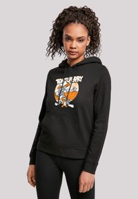 Čierna mikina s kapucňou, šnúrkami a predným vreckom. Obsahuje farebnú grafickú potlač "Tom a Jerry". Mäkká tkanina, voľný strih.