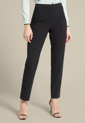 DRITTI IN STRETCH - Pantaloni - nero