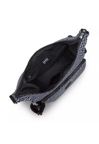Zippered handbag with a geometric black and white pattern, black interior, and a pom-pom accent. Features smooth fabric and sturdy hardware.