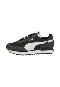 Black and grey sneaker crafted from suede and synthetic material, featuring a white Puma logo, textured accents, and a rubber sole.