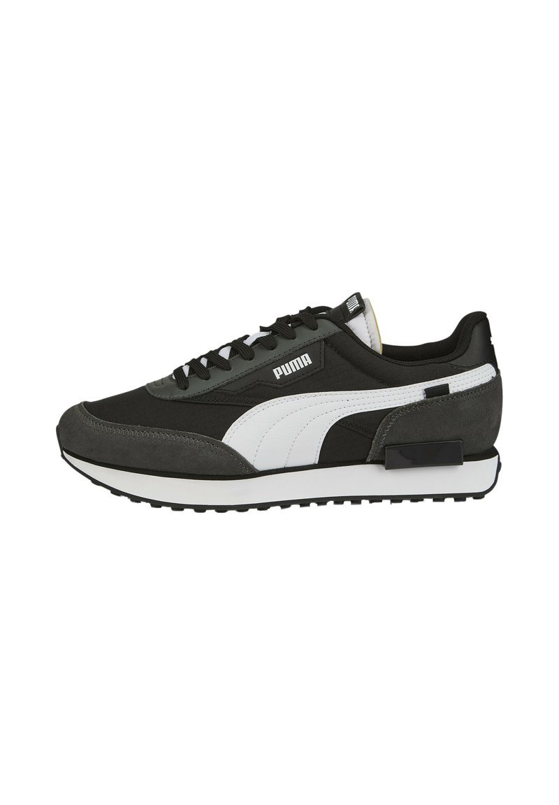Black and grey sneaker crafted from suede and synthetic material, featuring a white Puma logo, textured accents, and a rubber sole.
