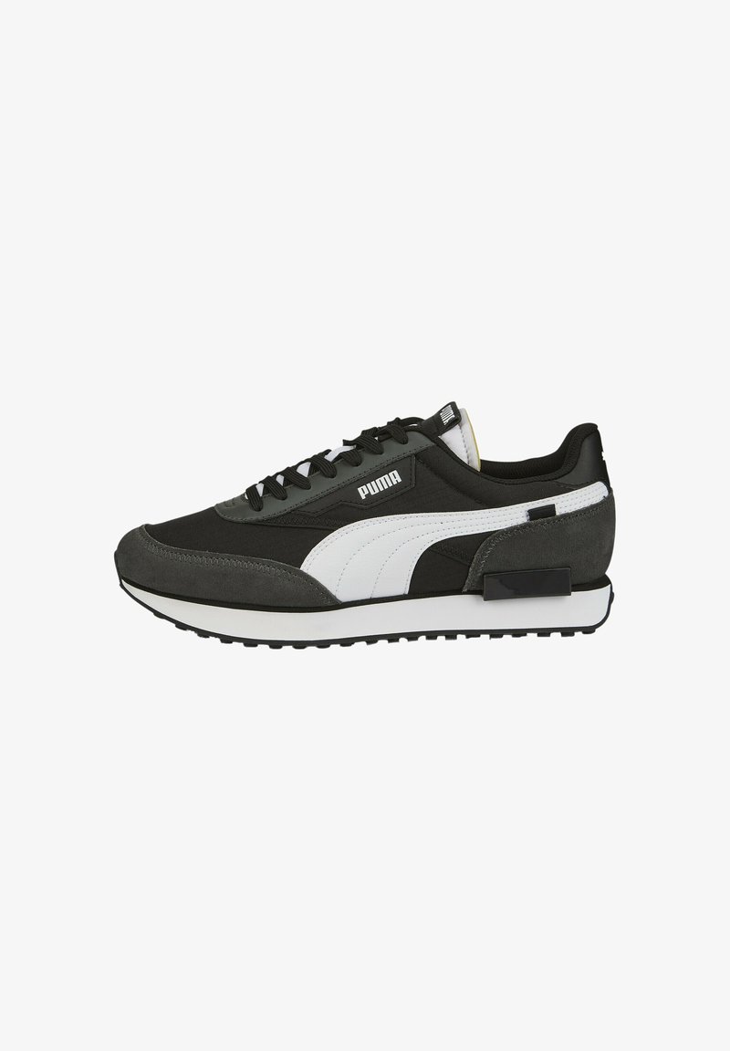 Black and grey sneaker crafted from suede and synthetic material, featuring a white Puma logo, textured accents, and a rubber sole.
