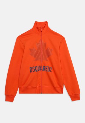 Bright orange zip-up jacket with a high collar, featuring a large maple leaf and "DSQUARED2" text on the front.